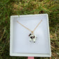 Black and white cow necklace