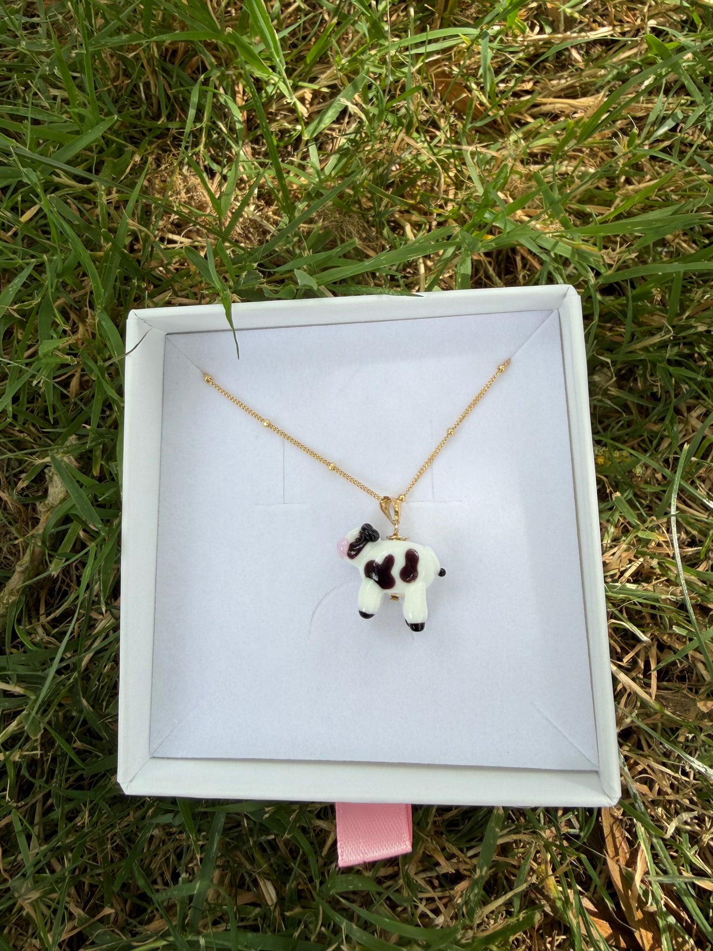 Black and white cow necklace