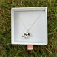 Black & white cow necklace