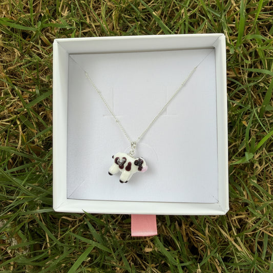 Black & white cow necklace